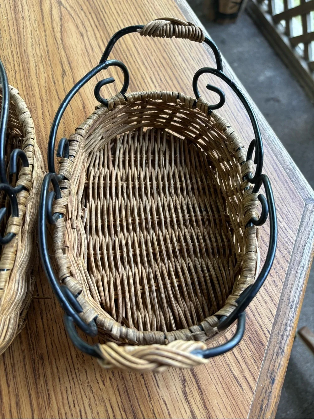 Two Woven Natural Rattan Baskets with Black Metal Handles Big 10x7, Small 8x5